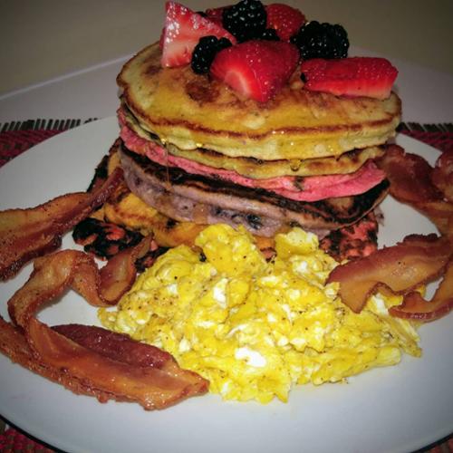 Rainbow pancakes, scrambled eggs, bacon